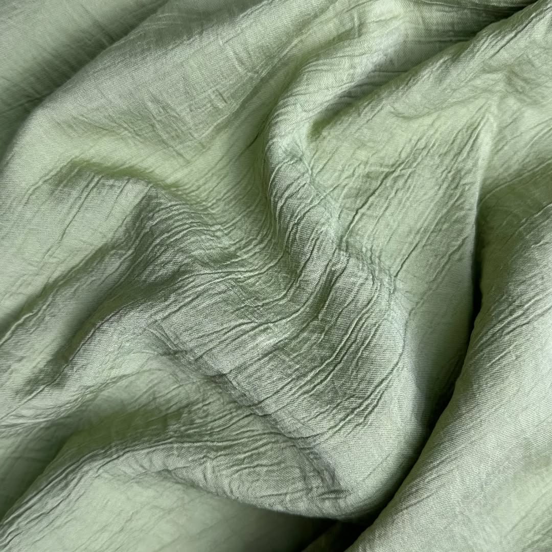 Light green textured dobby textile
